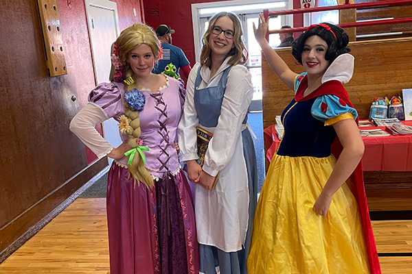 A group of three women dressed as Disney princesses. Click to enlarge.