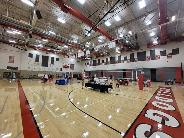 A wide photo of the entire gym, showing the many different tables set up. Click to enlarge.